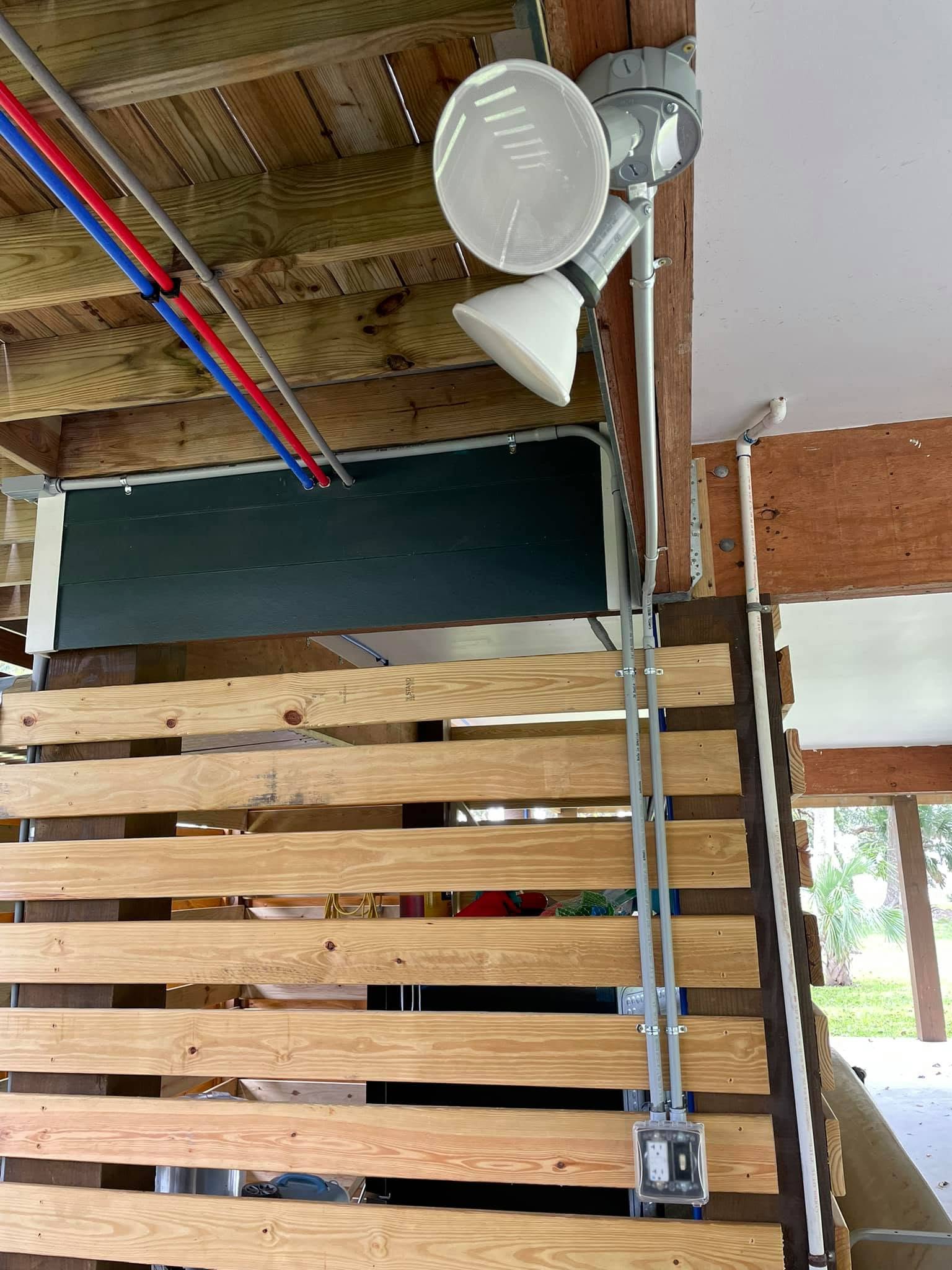 Weather-tight floodlight under deck