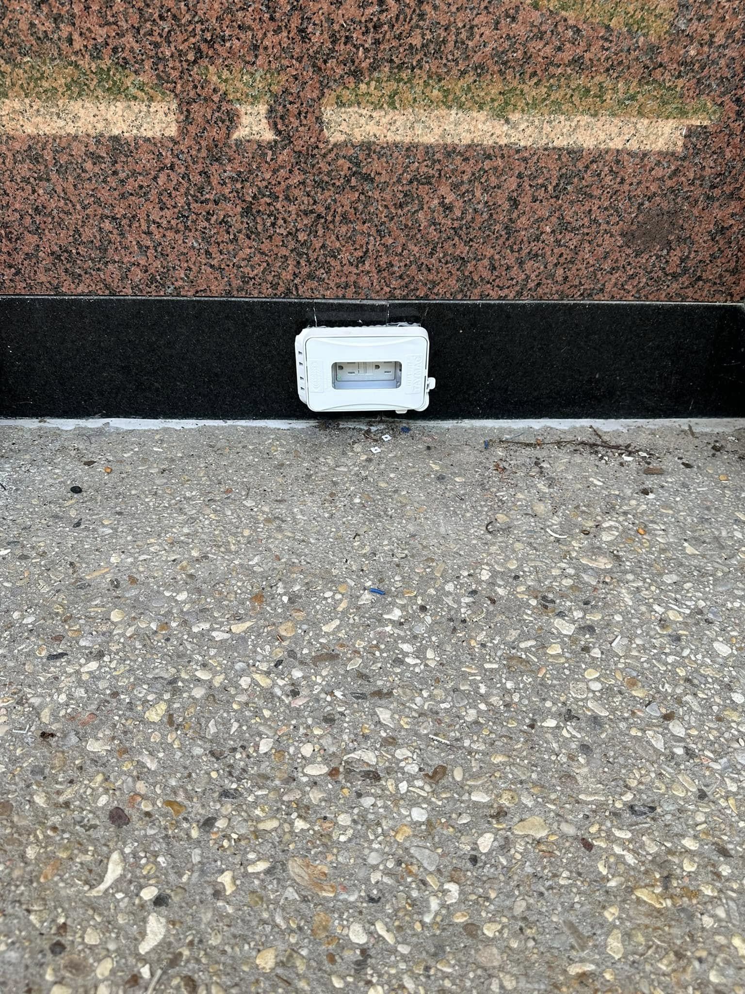 Outdoor outlet installed on stone wall